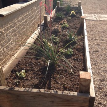 Raised garden beds with drip irrigation installed by Brainard's Greenscapes