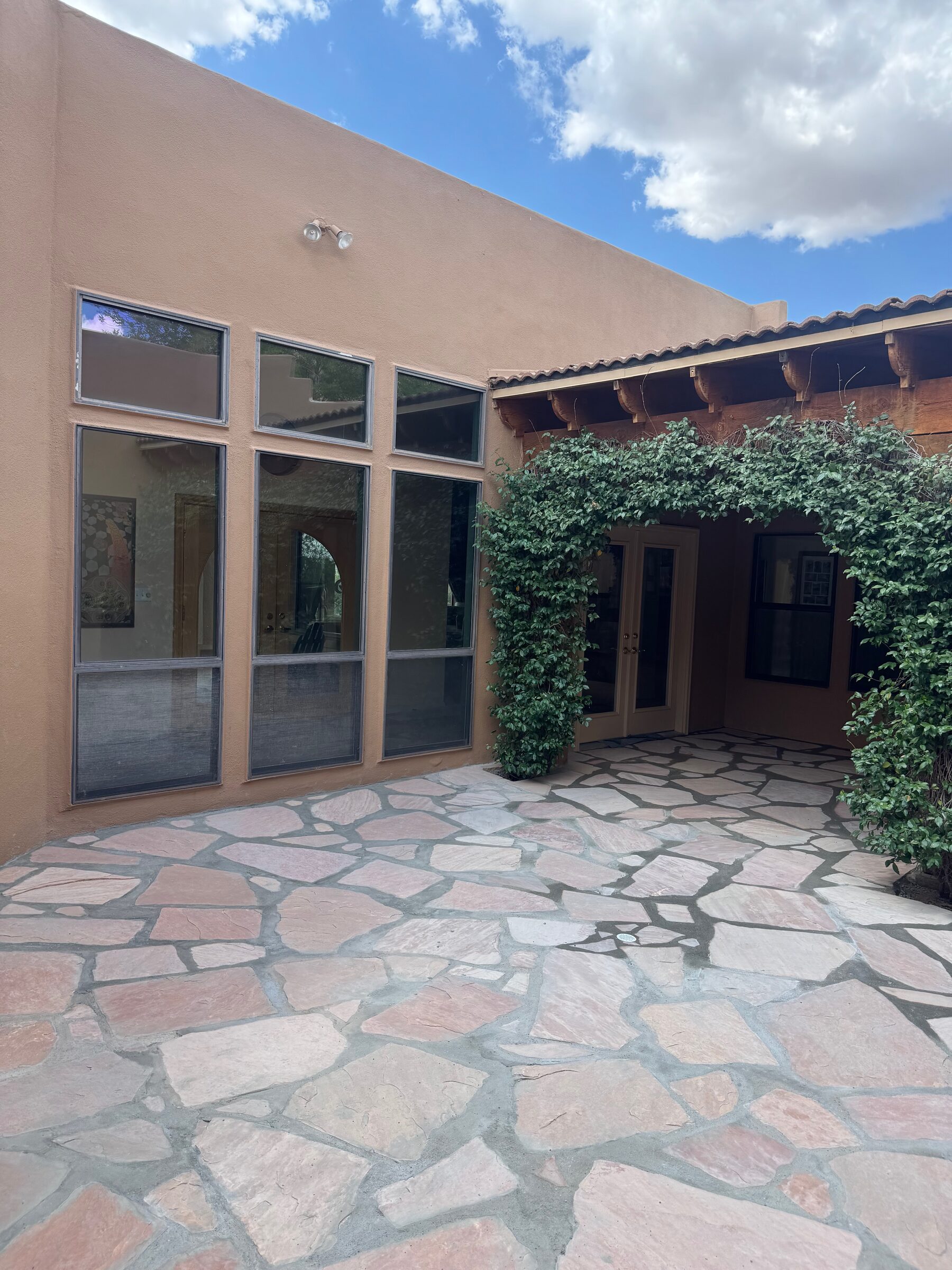 After: Las Cruces courtyard with hazard tree removed and new flagstone patio