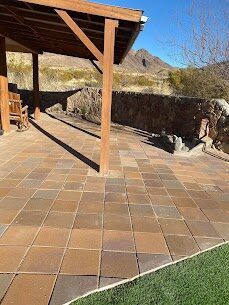Saltillo tile patio with wood pergola and mountain view