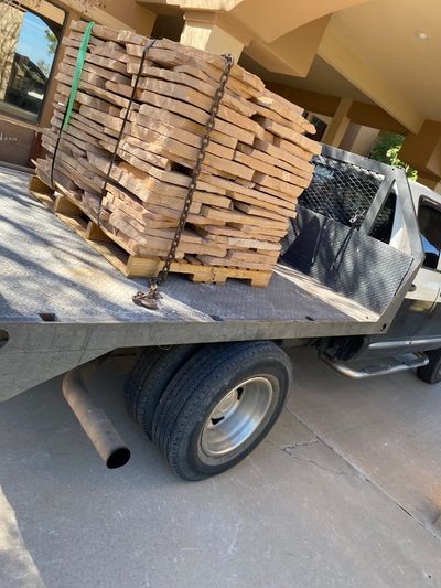 Pallet of new flagstone delivered by flatbed truck for a Las Cruces patio rebuild